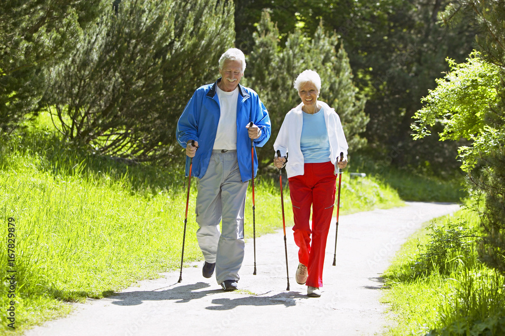 Senior couple doing Nordic walking