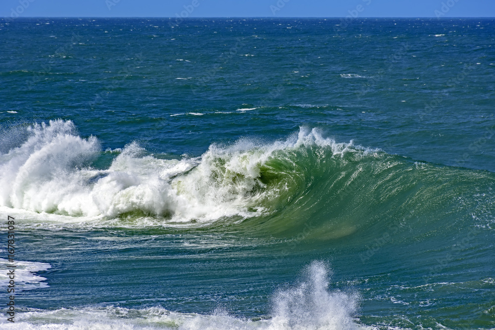 Big, dangerous waves during tropical storm in the green and blue waters of Rio de Janeiro, Brazil Big, dangerous waves during tropical storm in the green and blue waters of Rio de Janeiro, Brazil
