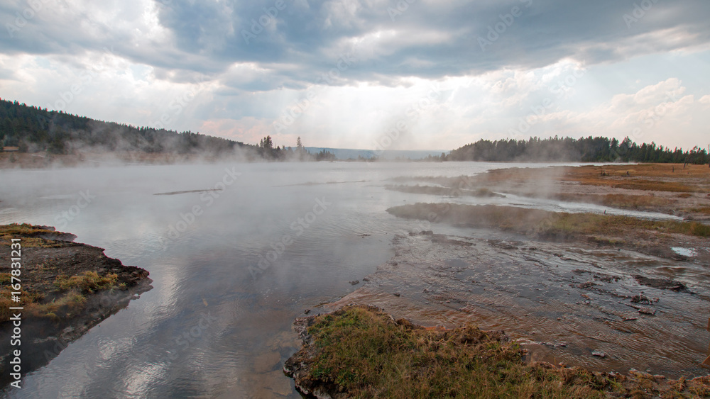 Steam rising off Hot Lake in the Lower Geyser Basin in Yellowstone National Park in Wyoming United States