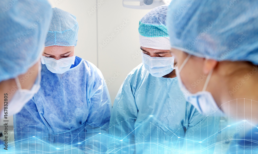 group of surgeons in operating room at hospital group of surgeons in operating room at hospital
