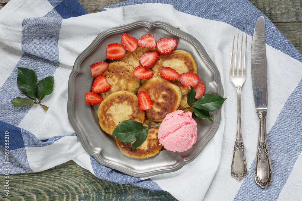 Pancakes with ice cream and ripe strawberry