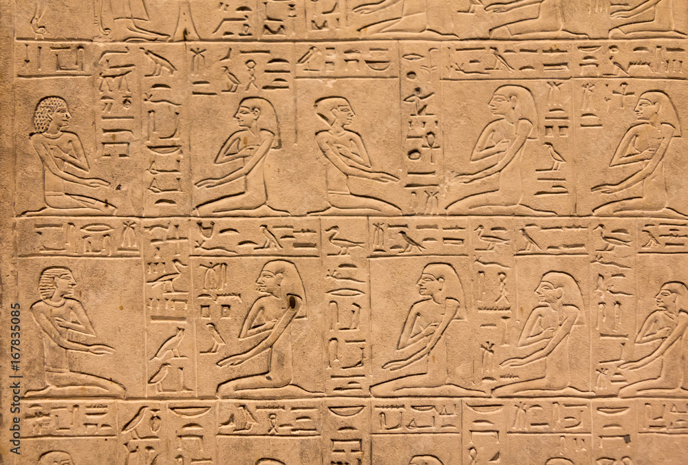 Hieroglyphic carvings on the exterior walls of an ancient egyptian temple