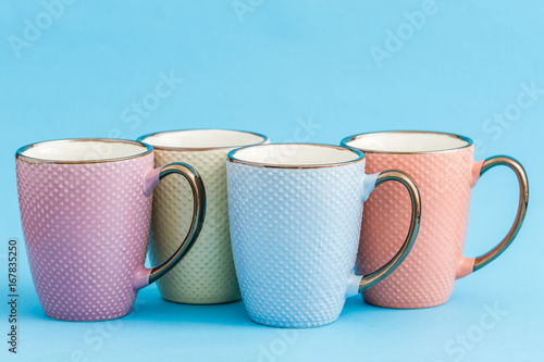 Colorful Coffee Mugs on Blue Background