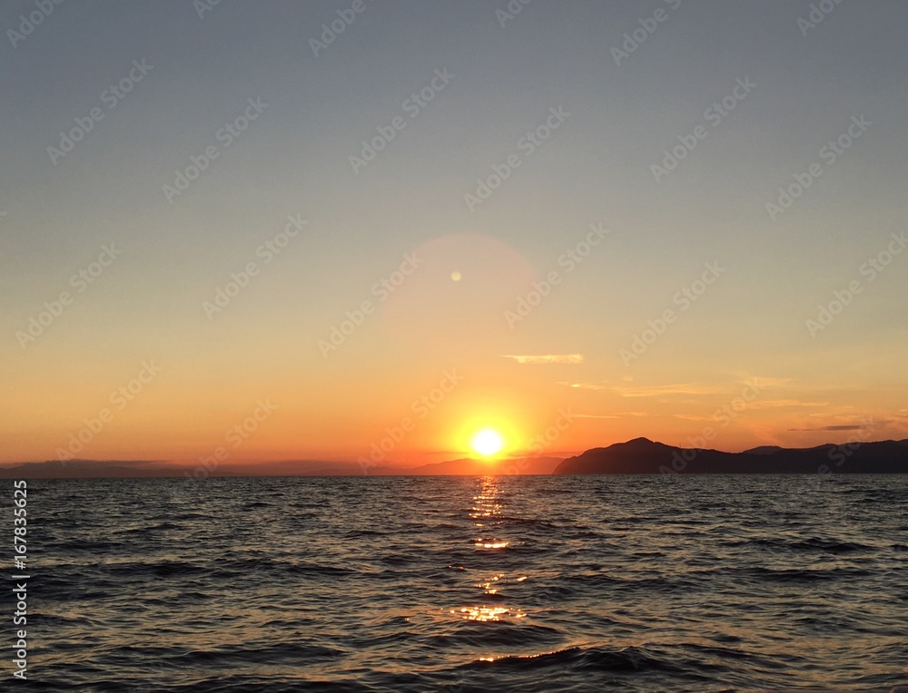 Naklejka premium sunset from the sea