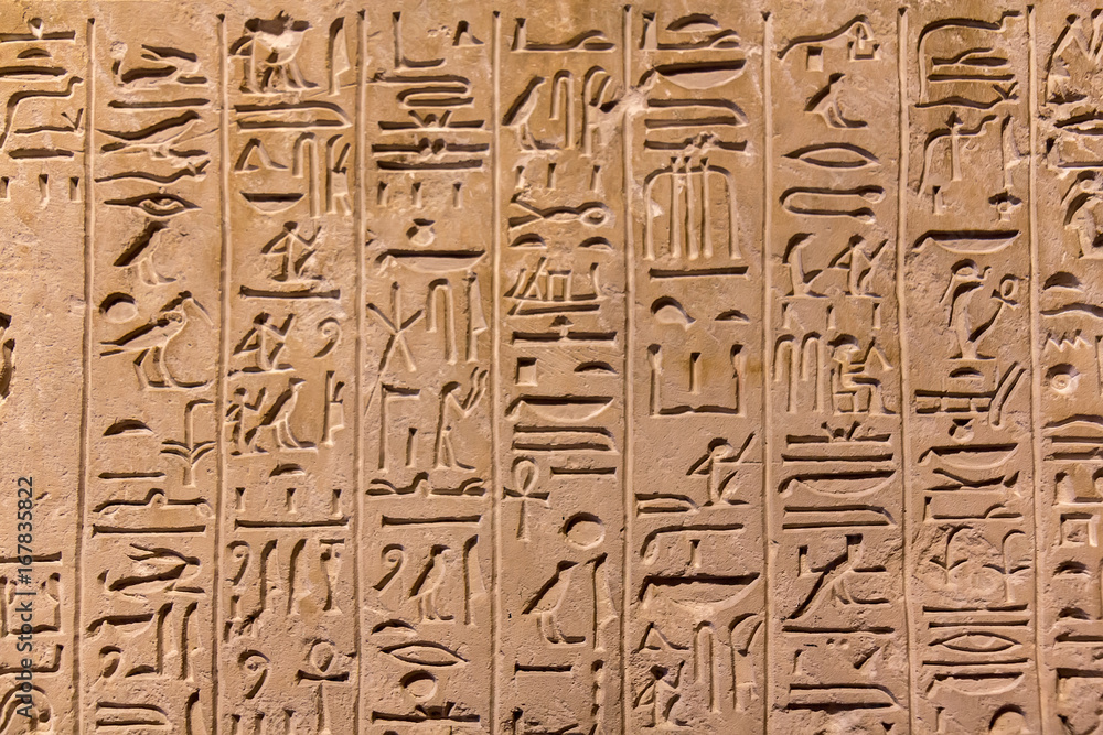 Hieroglyphic carvings on the exterior walls of an ancient egyptian temple Hieroglyphic carvings on the exterior walls of an ancient egyptian temple