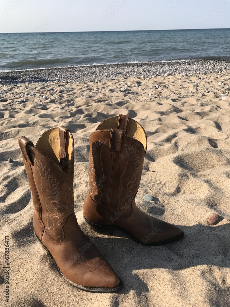 Cowboy Boots in Sand by Lake Superior in Summer Stock Photo | Adobe Stock
