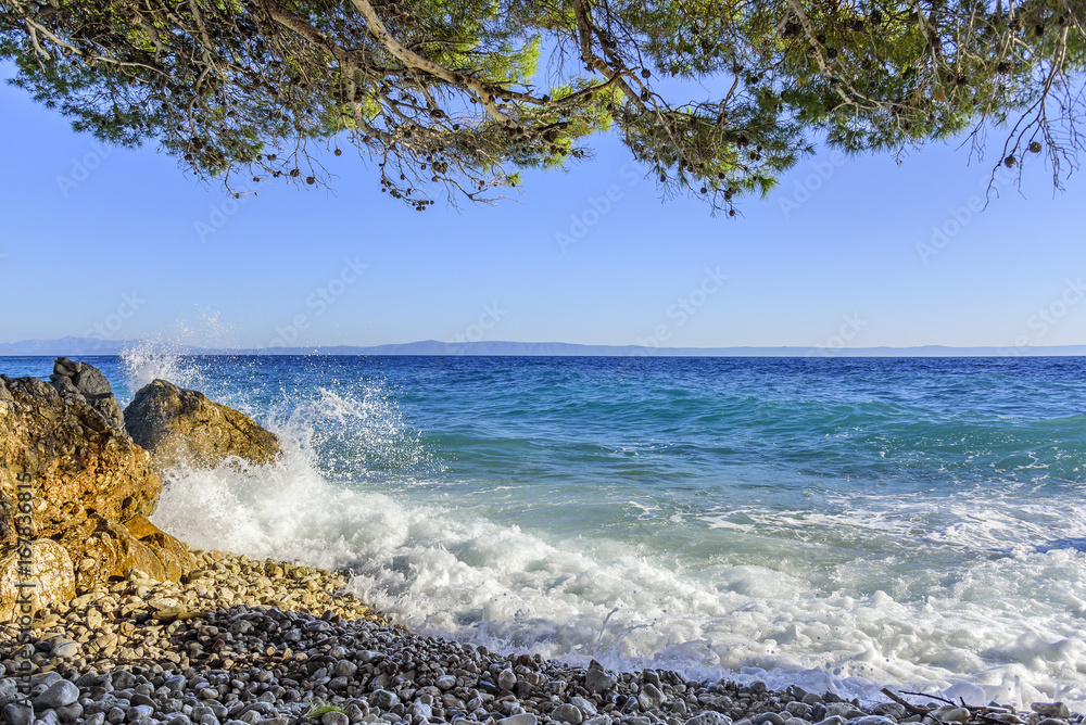 Sea beach. Sea waves crashing against the rocks on the coast. Sea beach. Sea waves crashing against the rocks on the coast.