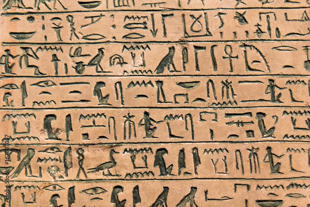 Hieroglyphic carvings on the exterior walls of an ancient egyptian temple Hieroglyphic carvings on the exterior walls of an ancient egyptian temple