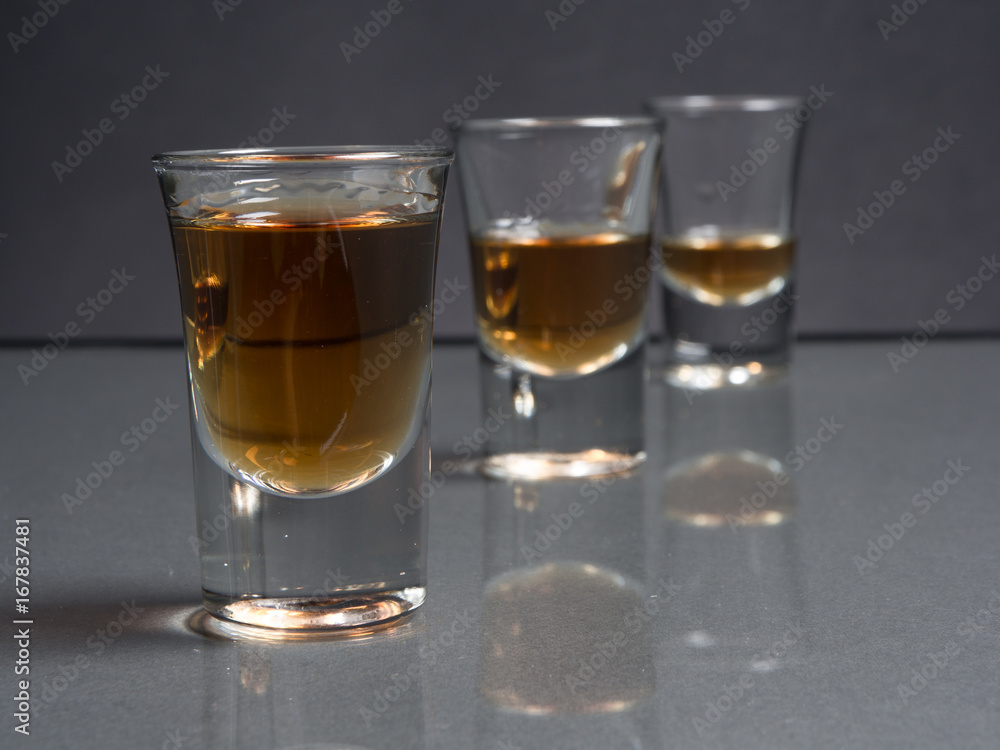 Whisky shot glass with reflections Whisky shot glass with reflections