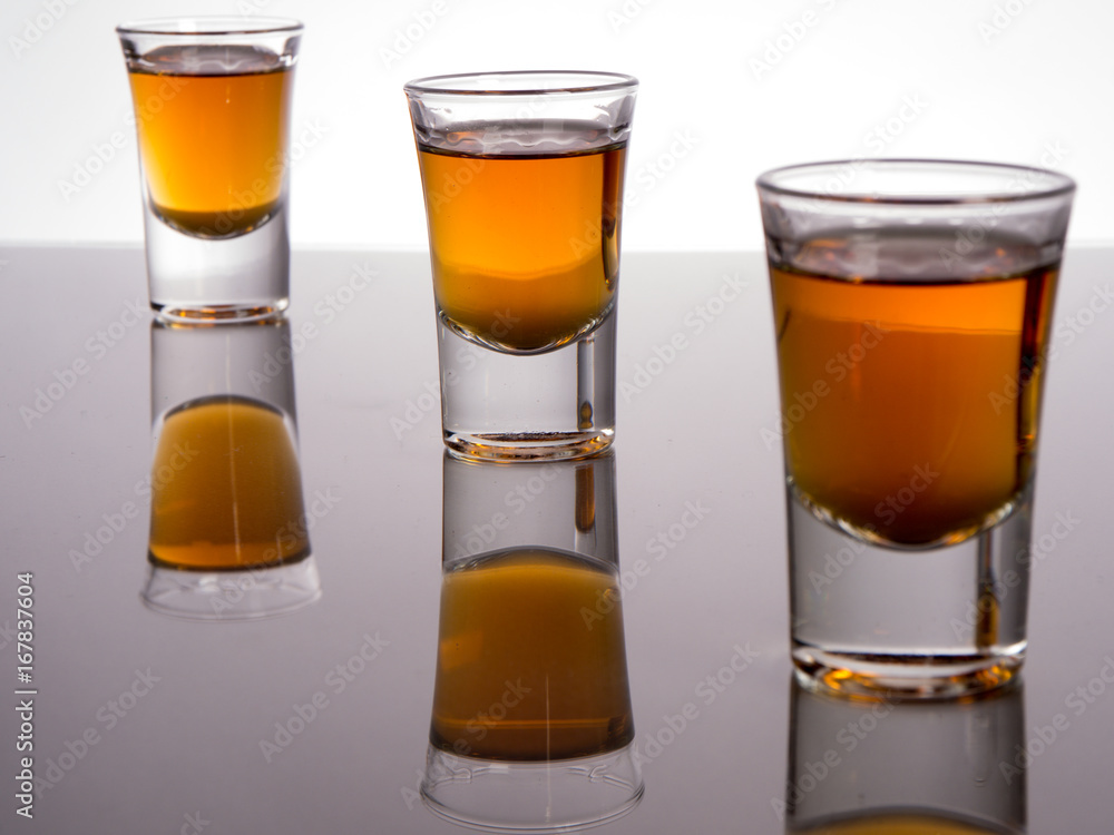 Whisky shot glass with reflections Whisky shot glass with reflections