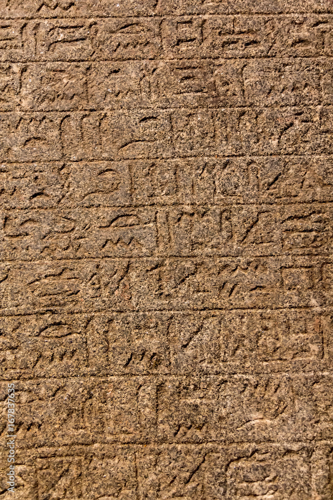 Hieroglyphic carvings on the exterior walls of an ancient egyptian temple Hieroglyphic carvings on the exterior walls of an ancient egyptian temple