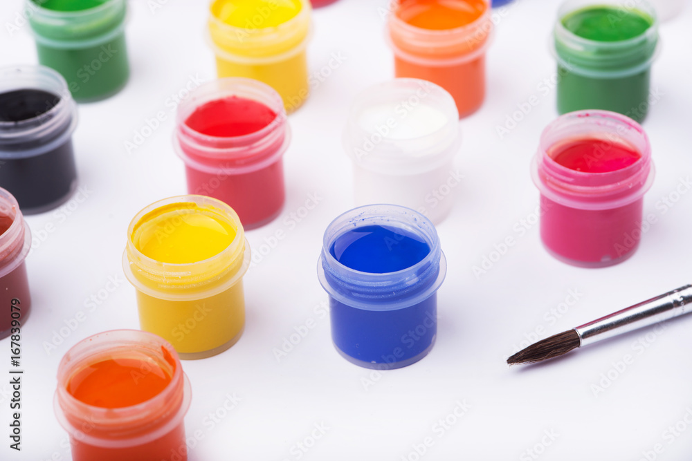 Containers with paints on white background Containers with paints on white background