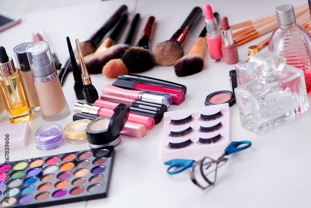 Collection of make up products displayed on the table Collection of make up products displayed on the table