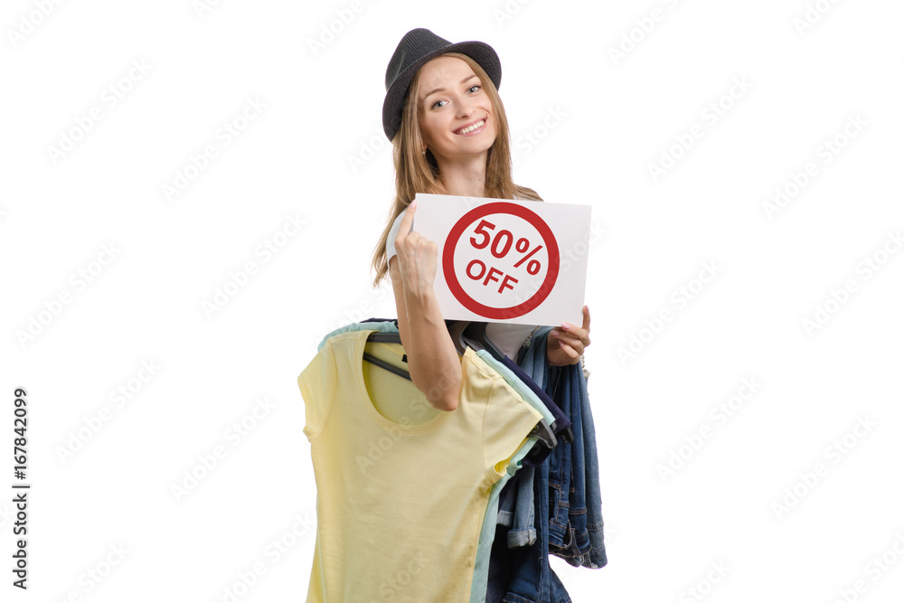 Beautiful young girl with things jeans t-shirt and with a sale sign hat