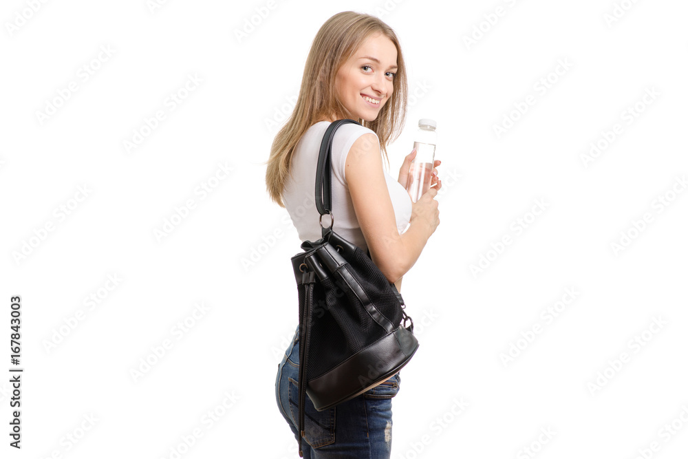 Beautiful young girl with a backpack and a bottle of water Beautiful young girl with a backpack and a bottle of water