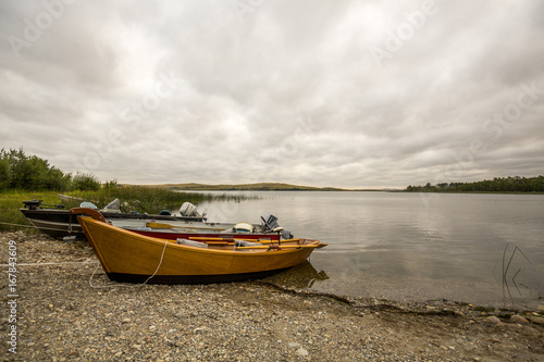 cloudy day with boats onshore