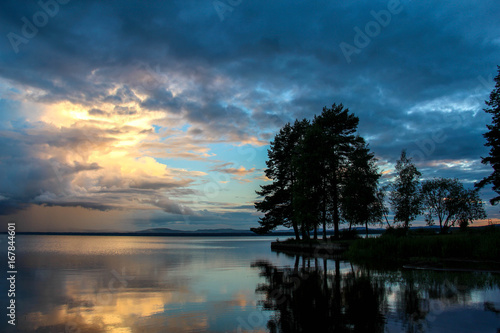 Sunset beach at Orsa Lake in Dalarna, Sweden. photo