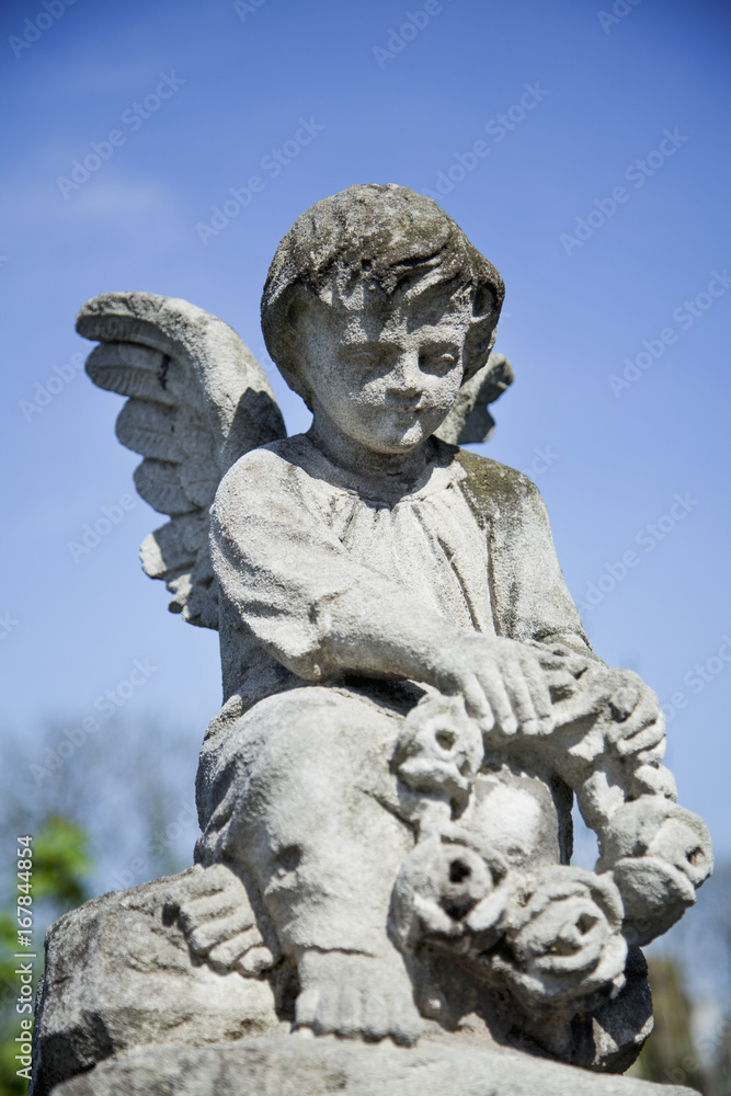 Angel as a symbol of faith, kindness and love. Ancient statue.