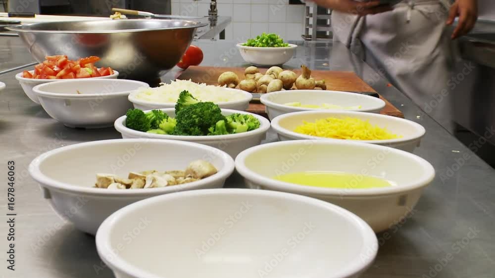 Toppings in bowl in kitchen, close up Toppings in bowl in kitchen, close up