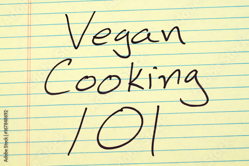 The words "Vegan Cooking 101" on a yellow legal pad
