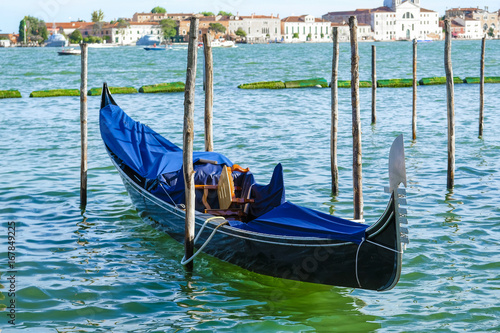 Venice, Italy, May, 31, 2017: gondolas on a channel in Venice, Italy