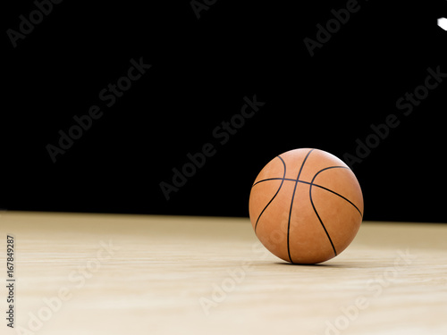 Basketball court wooden floor with ball isolated on black with copy-space © Martin Piechotta