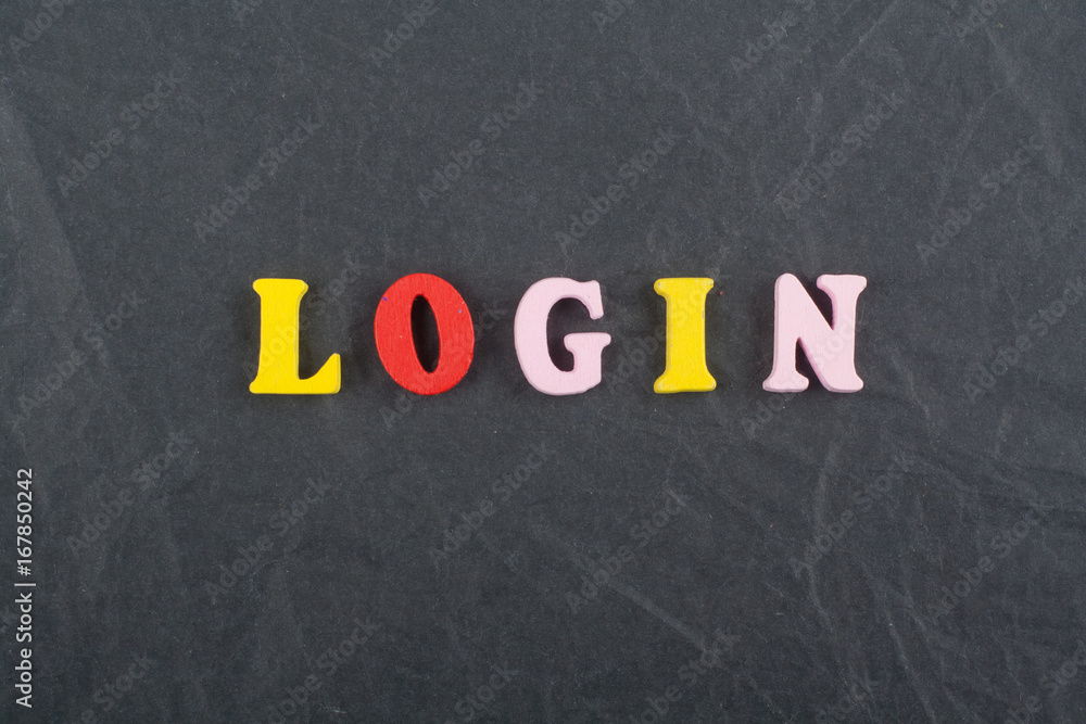 LOGIN word on black board background composed from colorful abc alphabet block wooden letters, copy space for ad text. Learning english concept. LOGIN word on black board background composed from colorful abc alphabet block wooden letters, copy space for ad text. Learning english concept.