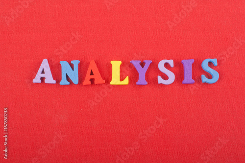 ANALYSIS word on red background composed from colorful abc alphabet block wooden letters, copy space for ad text. Learning english concept.