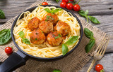 Spaghetti in pan with meatballs