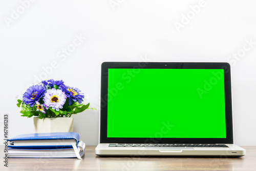 Laptop blank screen for text or pictures on wooden table. Concept for advertising  business and home office.