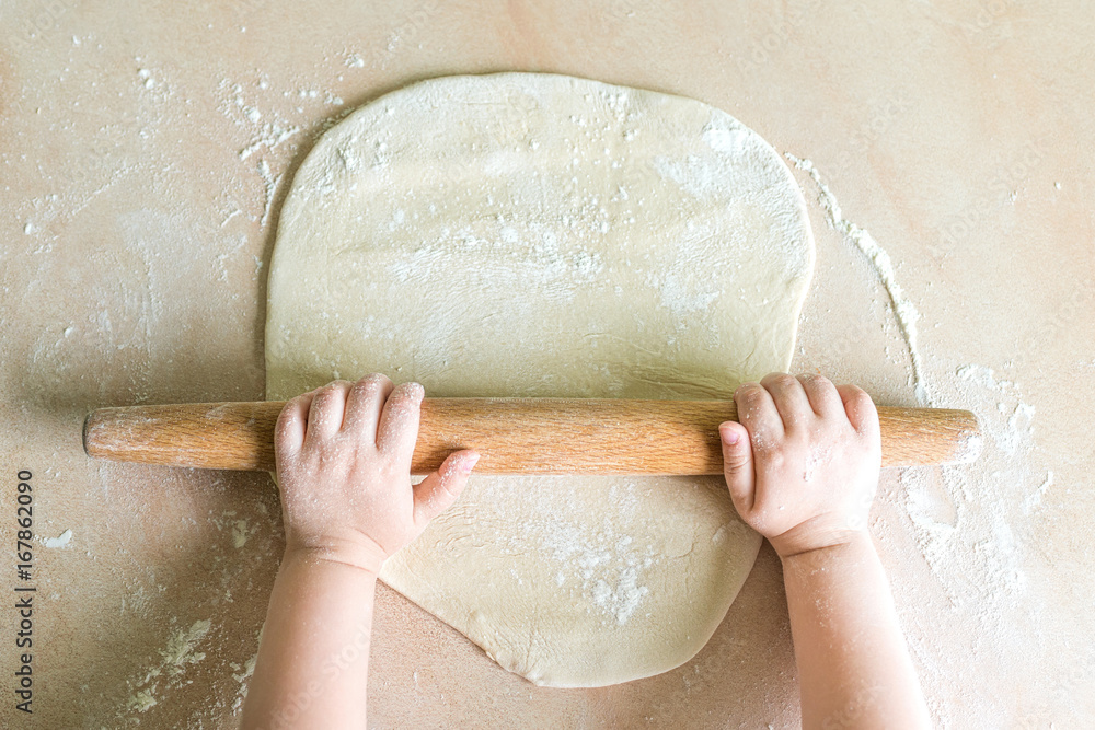 Children's hands rolled dough Children's hands rolled dough