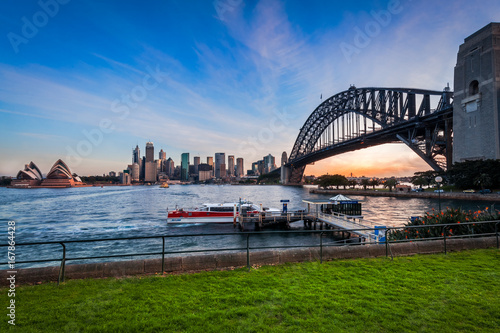 Panoramic view of Sydney Harbour at sunset with the two icons, the Sydney Harbour Bridge and Opera House from North Sydney in Australia © Daniela Photography