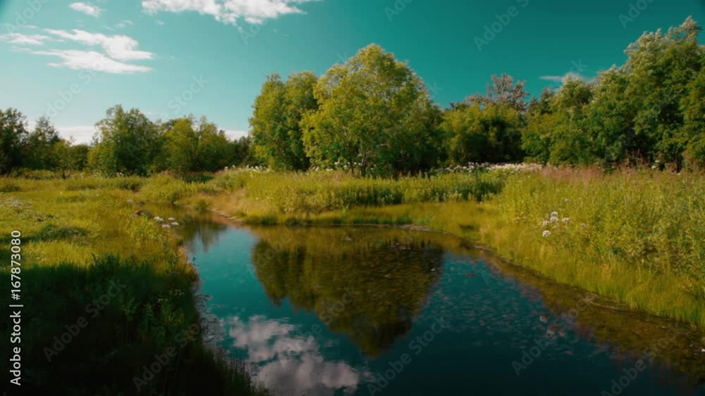 Charming oval pond in the picturesque park. Recreational tourism. Kamchatka Charming oval pond in the picturesque park. Recreational tourism. Kamchatka