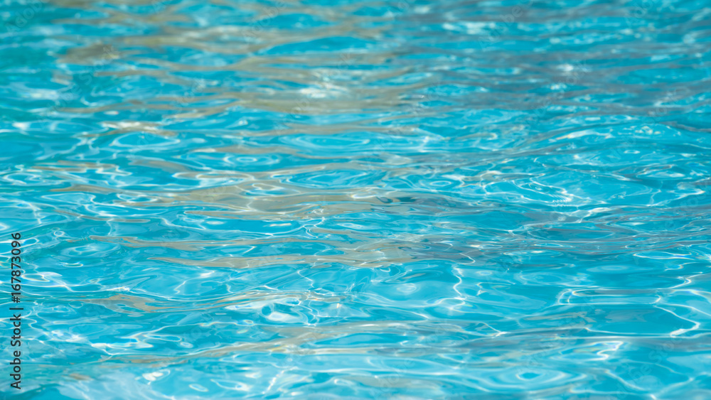 Close-up beautiful blue water surface and motion, Selective focus water surface in swimming pool