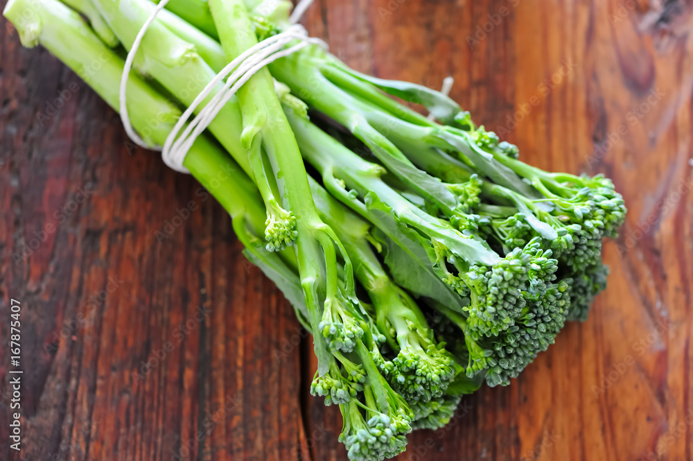 broccoli isolated closeup on wooden table broccoli isolated closeup on wooden table