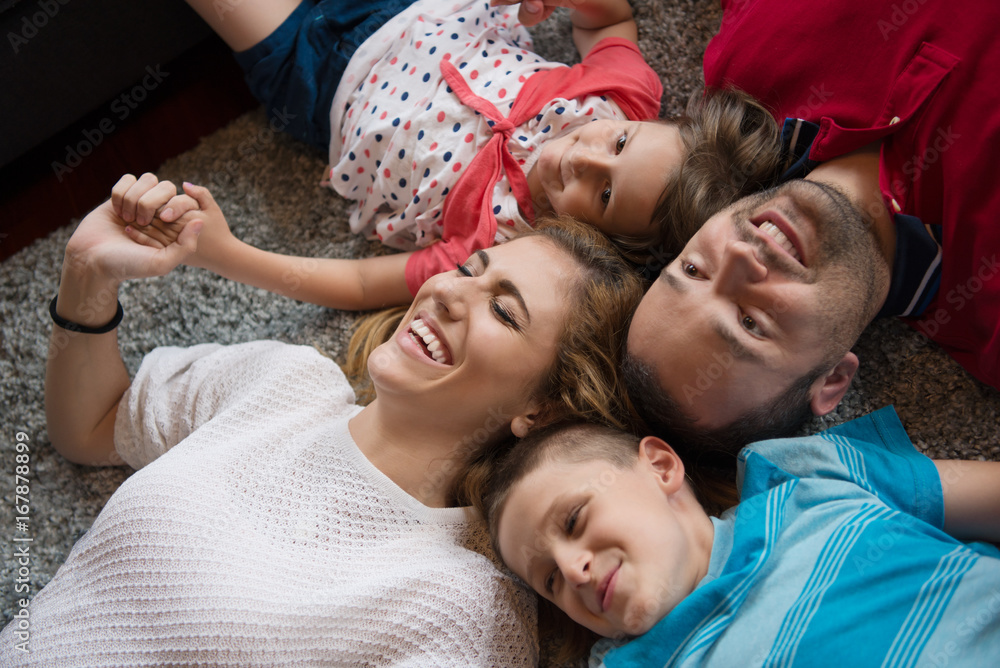 happy family lying on the floor