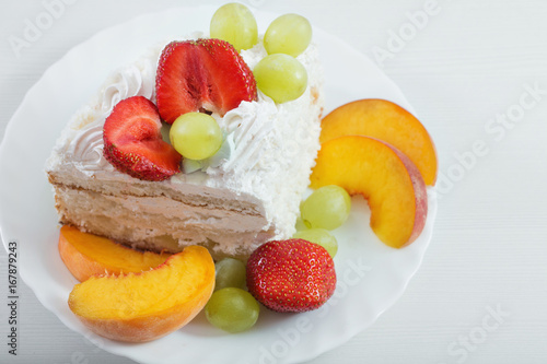 cake with fruits on white table