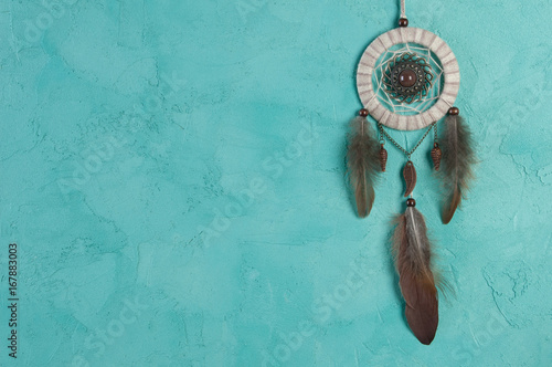 Dream catcher on aquamarine photo