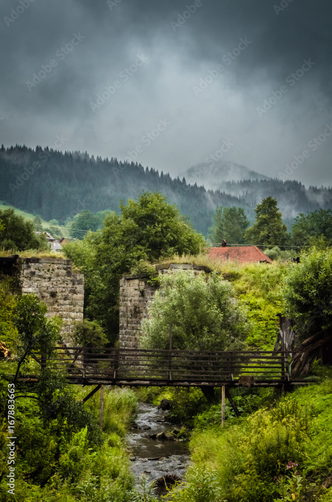 Beautiful Vorokhta place in Ukraine. Stone wall and old bridge