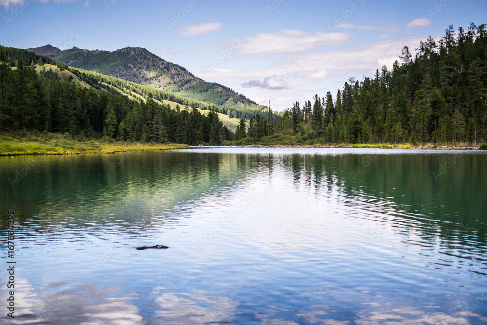 mountain lake in front of mountain range, national park in Altai republic, Siberia, Russia