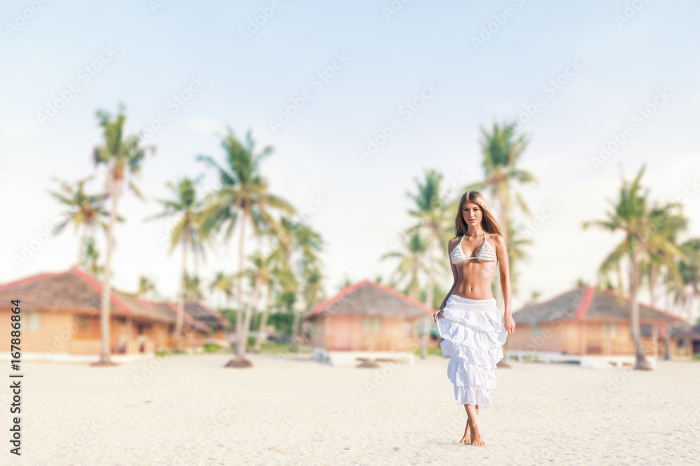 Young woman on tropical beach