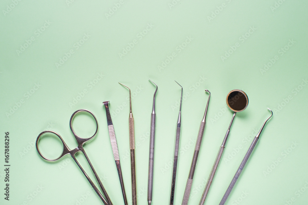 Dental instruments on colorful background Dental instruments on colorful background
