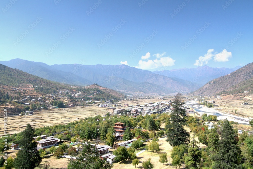 Aerial view of Thimphu City with Bhutanese traditional style houses near a river in Paro, Bhutan