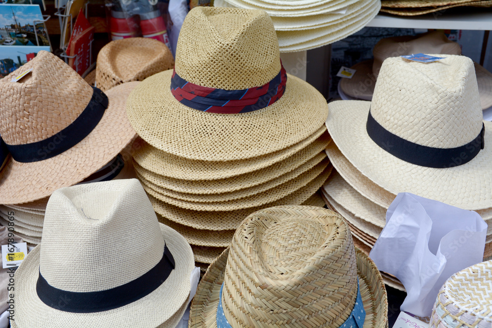 Stacks of hats for sale outside shop