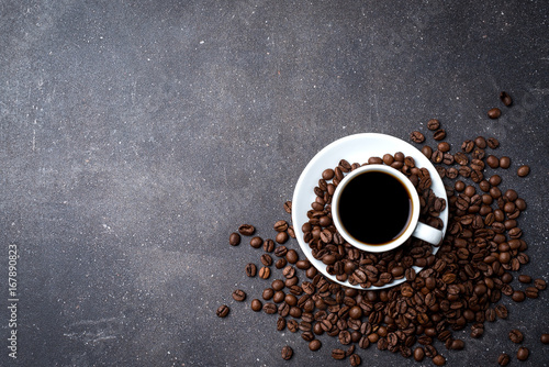 Cup of coffee with roasted coffee beans photo