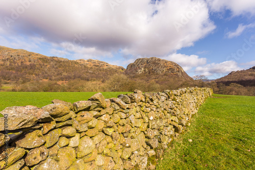 Wall on a mountain meadow in the English Lake District National Park in Cumbria, England, United Kingdom.