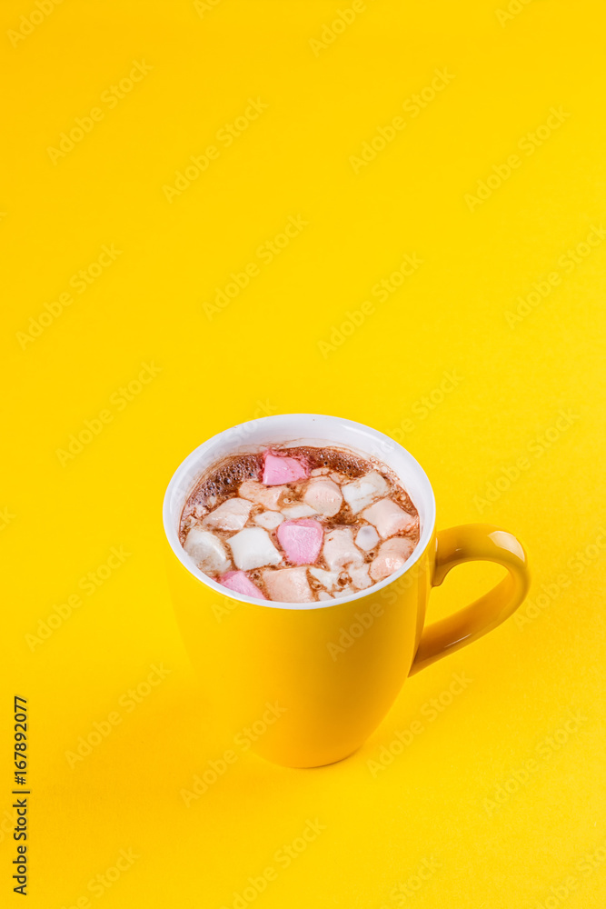 Yellow cup of hot cocoa with marshmallows Yellow cup of hot cocoa with marshmallows