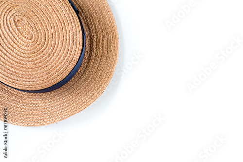 straw hat with black ribbon on white background