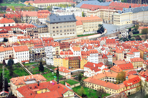 Aerial panoramic view of the historic center of Prague, Czech Republic. Red tiled roofs and colorful facades of landmarks.