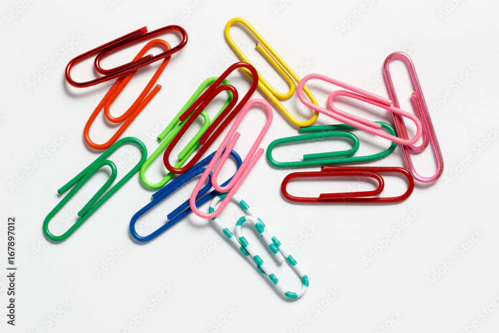 Multicolored paper clips on a white background Multicolored paper clips on a white background